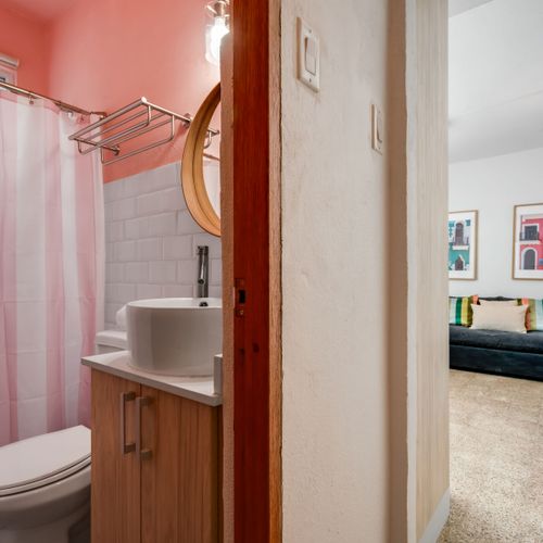 Thoughtfully Designed: From the elegant vanity to the modern fixtures, every element in this bathroom has been chosen to provide a comfortable and sophisticated experience during your stay.