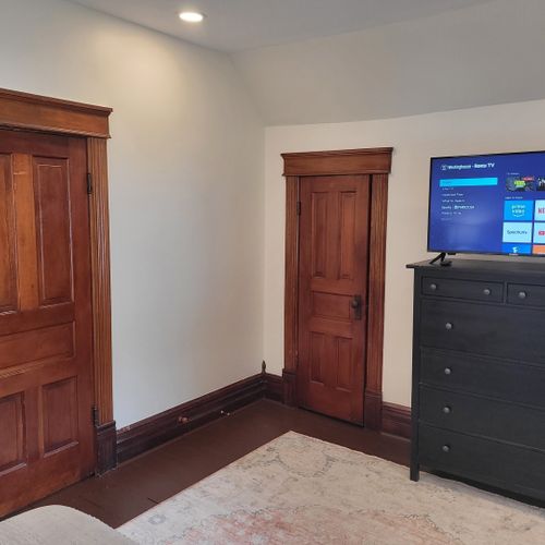 Bedroom #4 (second floor):  features a queen-size bed, dresser, television, nightstands, and a closet.