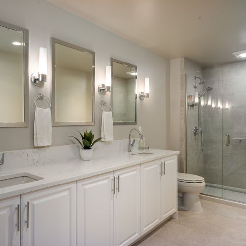 Guest bathroom with radiant floor heating, double vanity, and walk-in shower.  All guest amenities are provided along with quality towels.