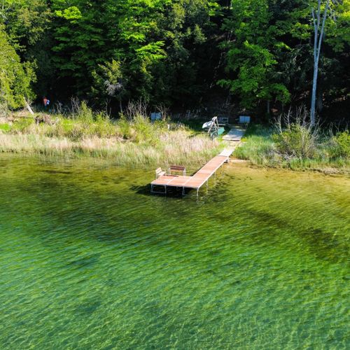 Exterior:  the beautiful colors of long lake next to the private lakefront and dock.