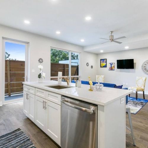 Well-appointed kitchen w/ island, stainless appliances & ample cabinet space.