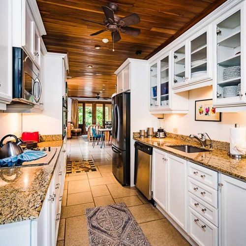Enjoy the beautiful granite counters and all the needed equipment in this modern-style kitchen.