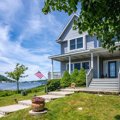 Exterior:  another view of the front of the house, with betsie lake in the background.