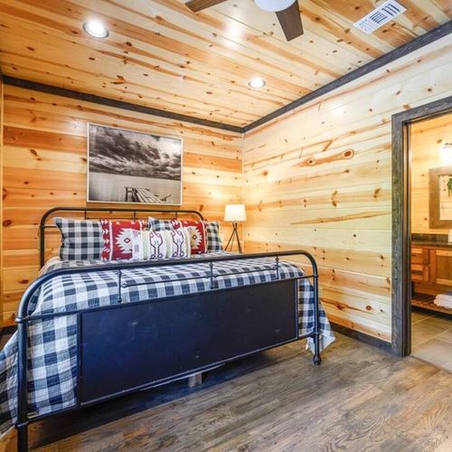 Upstairs King Bedroom 3 with a private bath + a twin daybed with trundle.