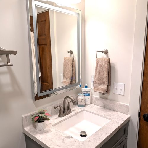 BATHROOM #3 (LOWER LEVEL):  Full bathroom on the lower level (first floor) with a combination tub and shower.