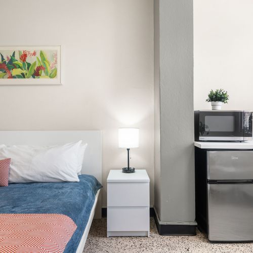 Every detail in this bedroom is designed with your comfort in mind, from the soothing decor to the convenient bedside amenities, making your stay seamless and pleasant.