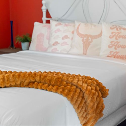 Sink into fresh linens and enjoy a restful night on the queen sized bed