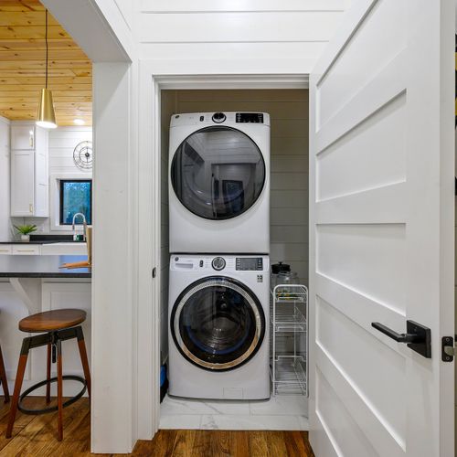 A washer and dryer are found off of the kitchen.