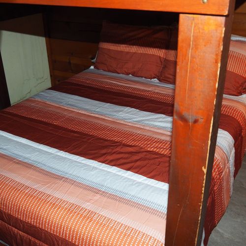 Bedroom #2:  features a full-on-full bunk bed, dresser, closet, and chair.