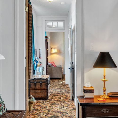 Charming entryway w/ warm vintage touches to welcome you in.
