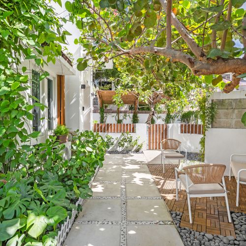 Immerse yourself in nature with beautiful foliage lining the peaceful path.