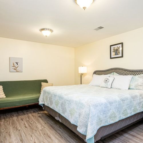Bedroom #5 (lower level):  this is a very large bedroom with a king-size bed, sofa, closet, and dresser.
