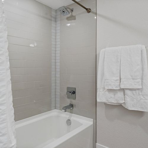 Bright whites and modern finishes invite you to soak, relax, and reset.