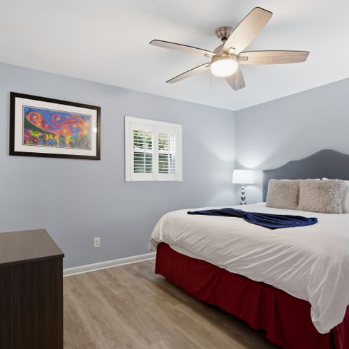 Bright bedroom w/ a cozy bed ready for a restful night