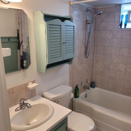 Bathroom #1:  full bathroom with a combination tub and shower.