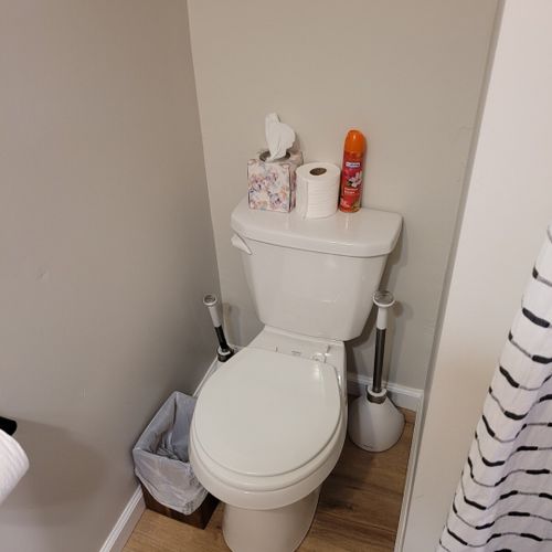 Bathroom #2:  second full bathroom that also serves as the laundry room having a stacked washer and dryer in it.