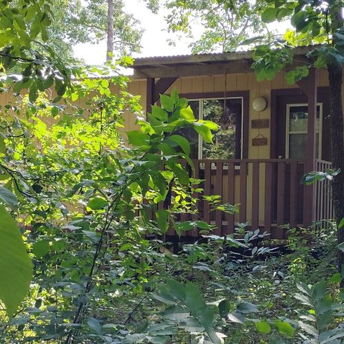 Exterior:  the front of the cabin in summer. (note the "hillbilly chic" styling. ;-)