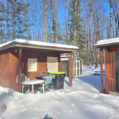 Exterior:  the driveway, shed, and backyard