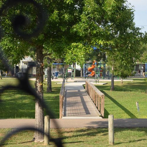 Lush, tree-lined path along the Lafitte Greenway right at your doorstep.