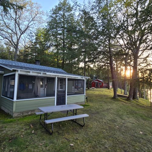 Exterior:  the cabin with little platte lake in the backgrround
