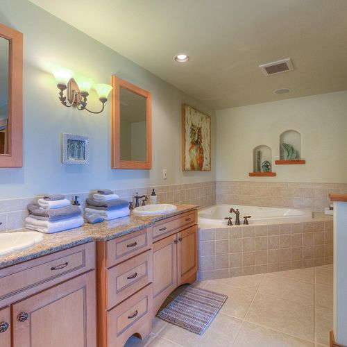 Master Bathroom jetted tub with bubble bath provided.