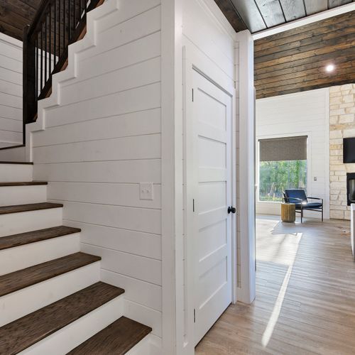 The staircase next to the laundry closet!