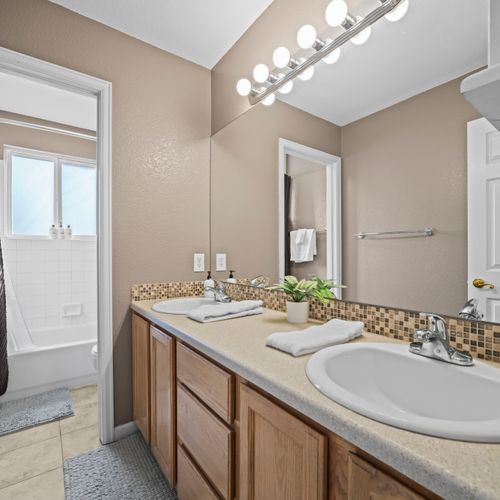 Well-lit bathroom with practical layout and fresh details