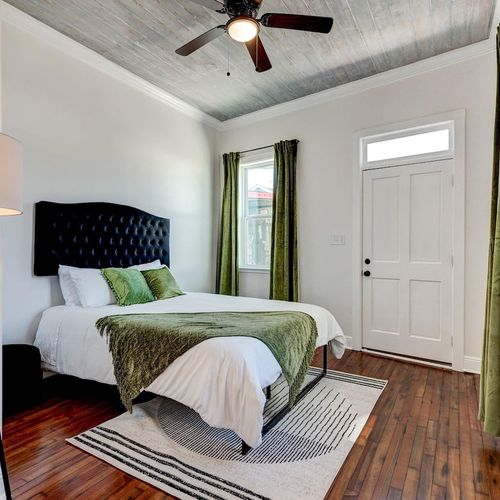 Rest easy in the queen bedroom, decorated w/ a cozy, curated touch.