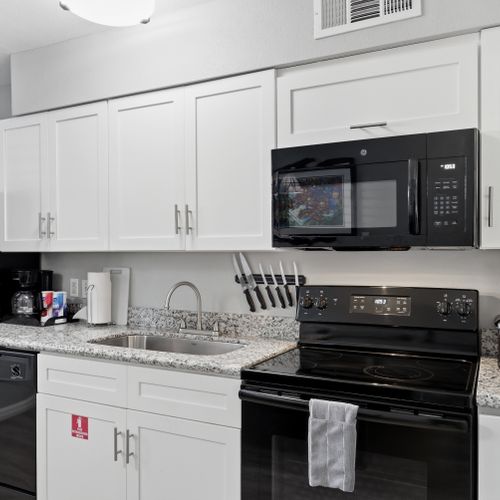 Fully equipped kitchen w/ modern appliances ready for any meal.