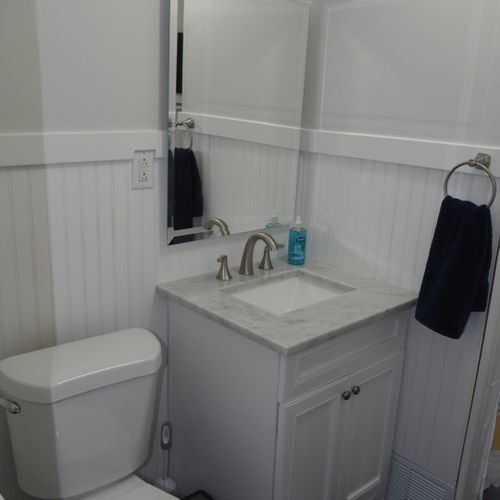 Bathroom #2 (upstairs):  there is a full bathroom upstairs with a combination bathtub / shower, toilet, vanity, sink, and mirror.