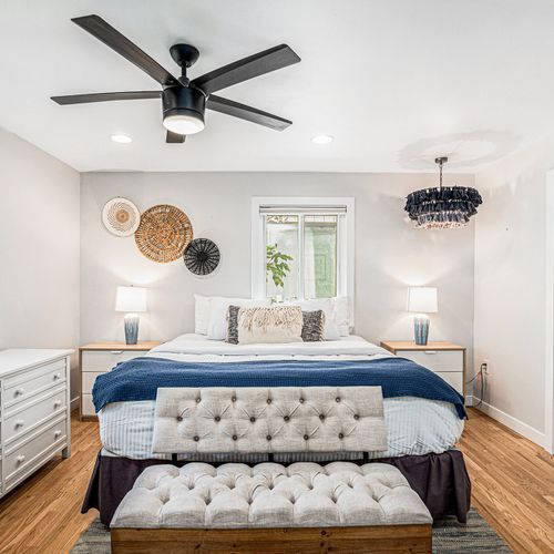 Master bedroom retreat with a plush bed and soothing decor.