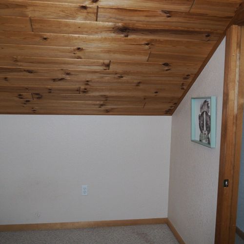 Bedroom #4 (upstairs):  features a twin-on-twin bunk bed, table, and a closet.