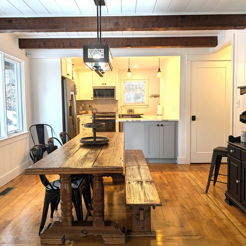 DINING ROOM (MAIN FLOOR):  Beautiful dining room with custom-made dining table that seats 8 adults