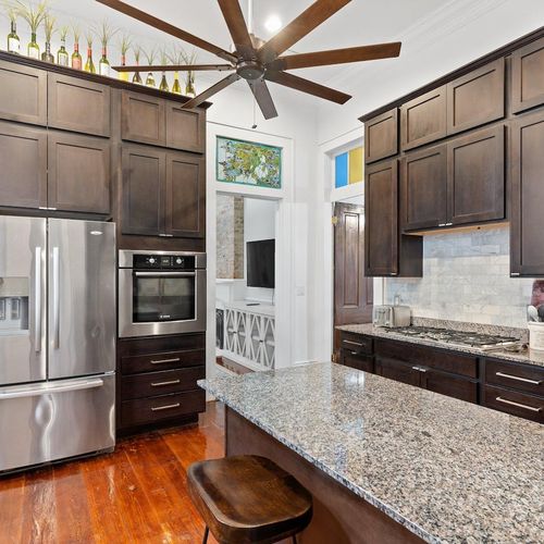 Spacious kitchen w/ stainless appliances & bar stools — great for cooking & catching up.
