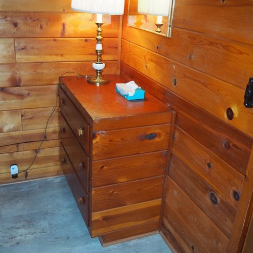 Bedroom #2:  features a full-on-full bunk bed, dresser, closet, and chair.