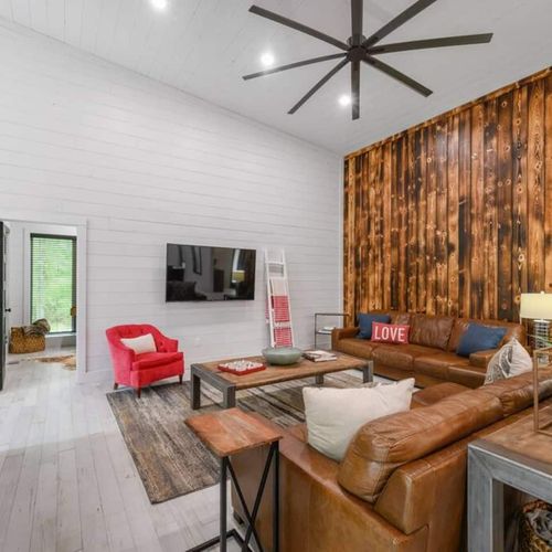 There is plenty of seating in this main living room. Game room thru the door.