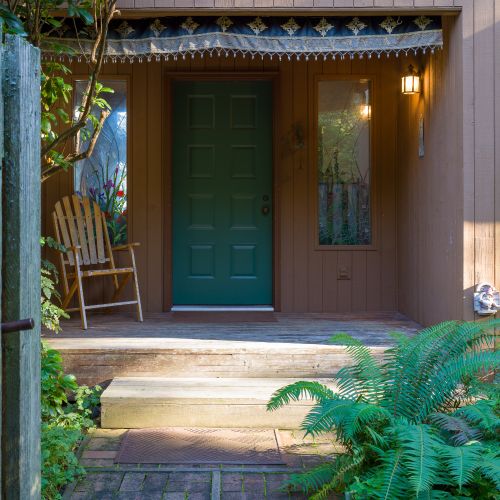 Entry way to Spotted Deer Hideaway where Gnomes and Prayer Flags great you at the door.