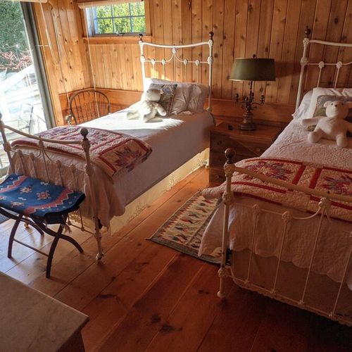 Bedroom #4 (second floor):  this is a very cute little kids bedroom with matching twin beds and its own private entrance down to the backyard patio.