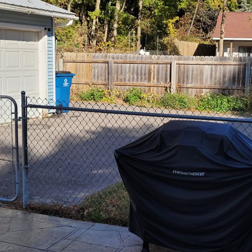 Exterior:  the grill next to the driveway