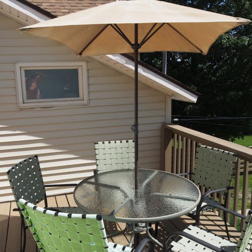 Exterior:  another view of the private deck and dining furniture for the apartment.