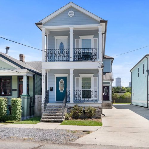 Charming exterior w/ a classic balcony — full of character from the moment you arrive.
