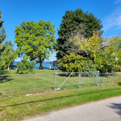 EXTERIOR:  Additional parking is available in the yard via the gate shown in the photo.