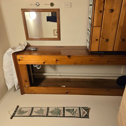 Bedroom #2:  features a full-size bed, nightstand, lamp, and dresser.