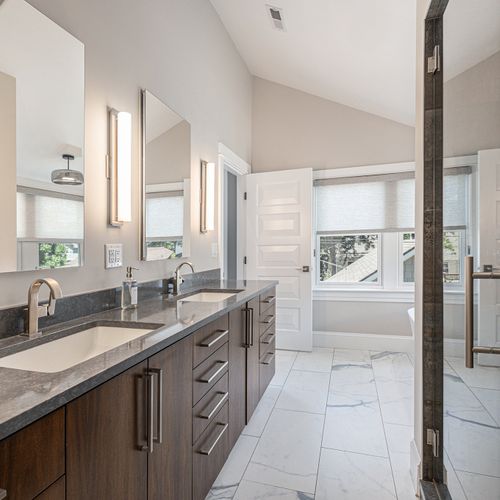 Chic, modern bathroom with steam shower and soaker tub