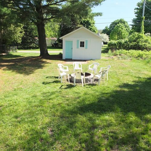 Exterior:  looking out at the backyard from the deck. (note that the shed is used for owner storage and is not available for guests. )