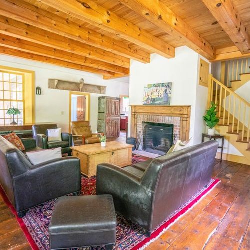 Main floor living area with fireplace and small library