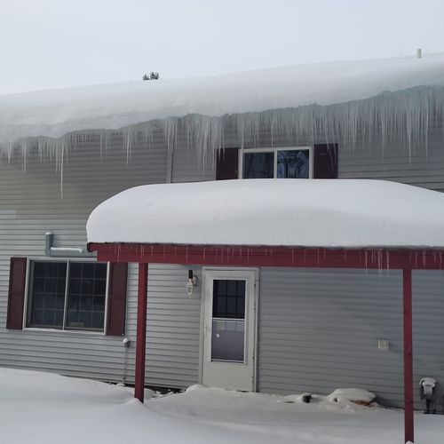 Overall:  the back of the home in winter.