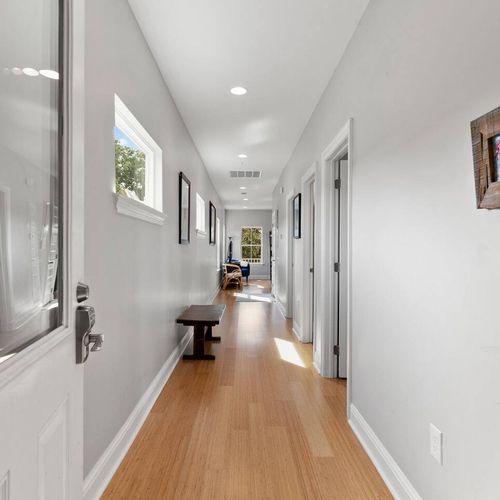 Bright hallway leading to the bedrooms — clean, open & easy to navigate.