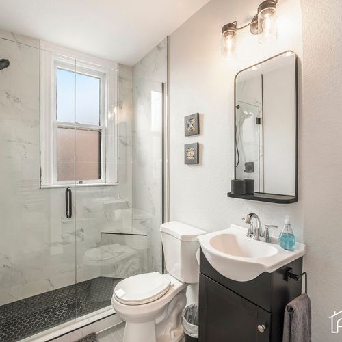 Our bathroom features a spacious walk-in shower