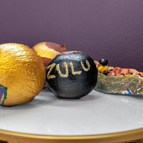 Celebrate the spirit of Mardi Gras with these iconic Zulu coconuts—a fun nod to New Orleans' vibrant traditions, adding local charm to your stay.